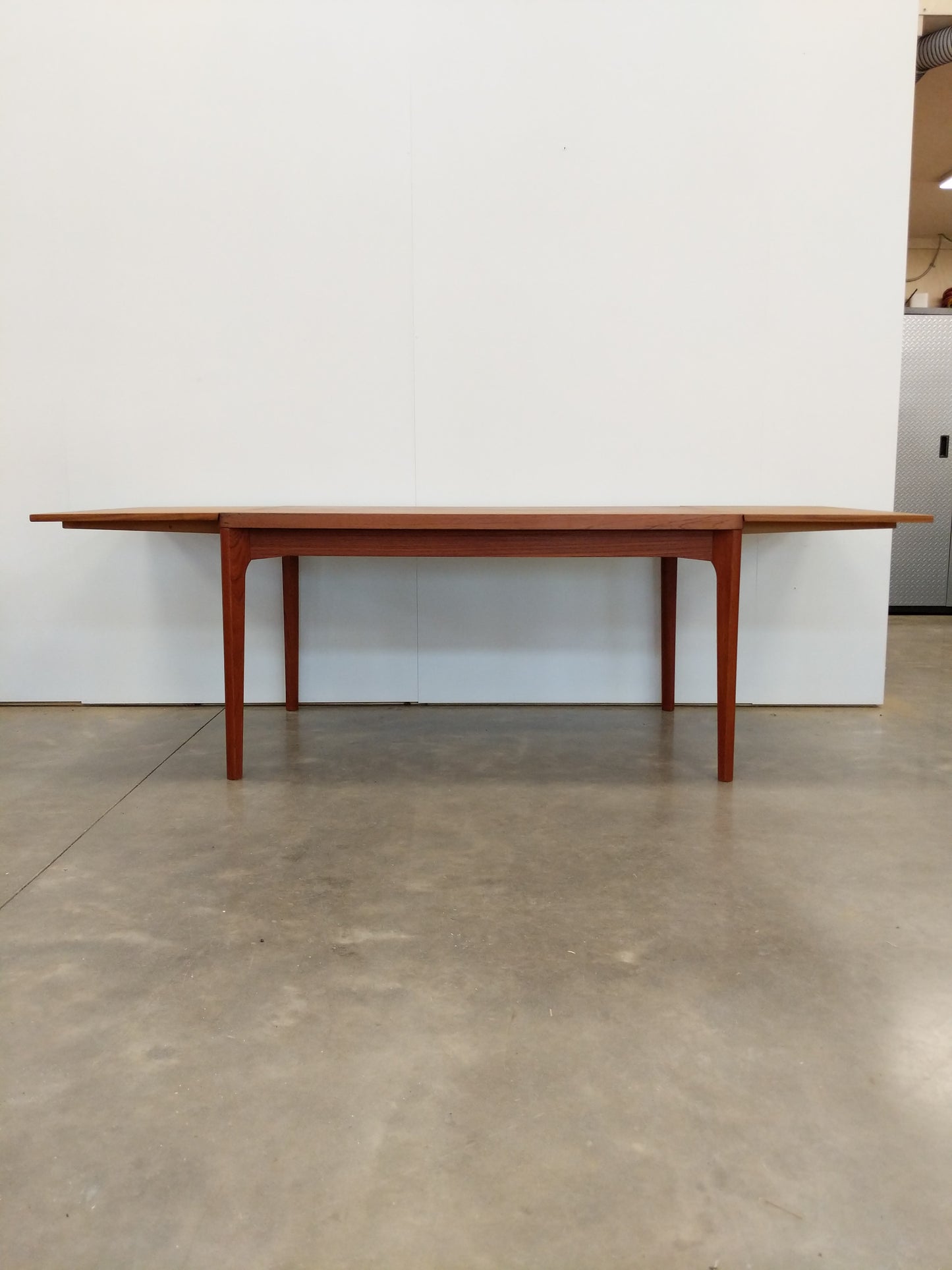 Vintage Danish Modern Teak Extendable Dining Table by Henning Kjaernulf