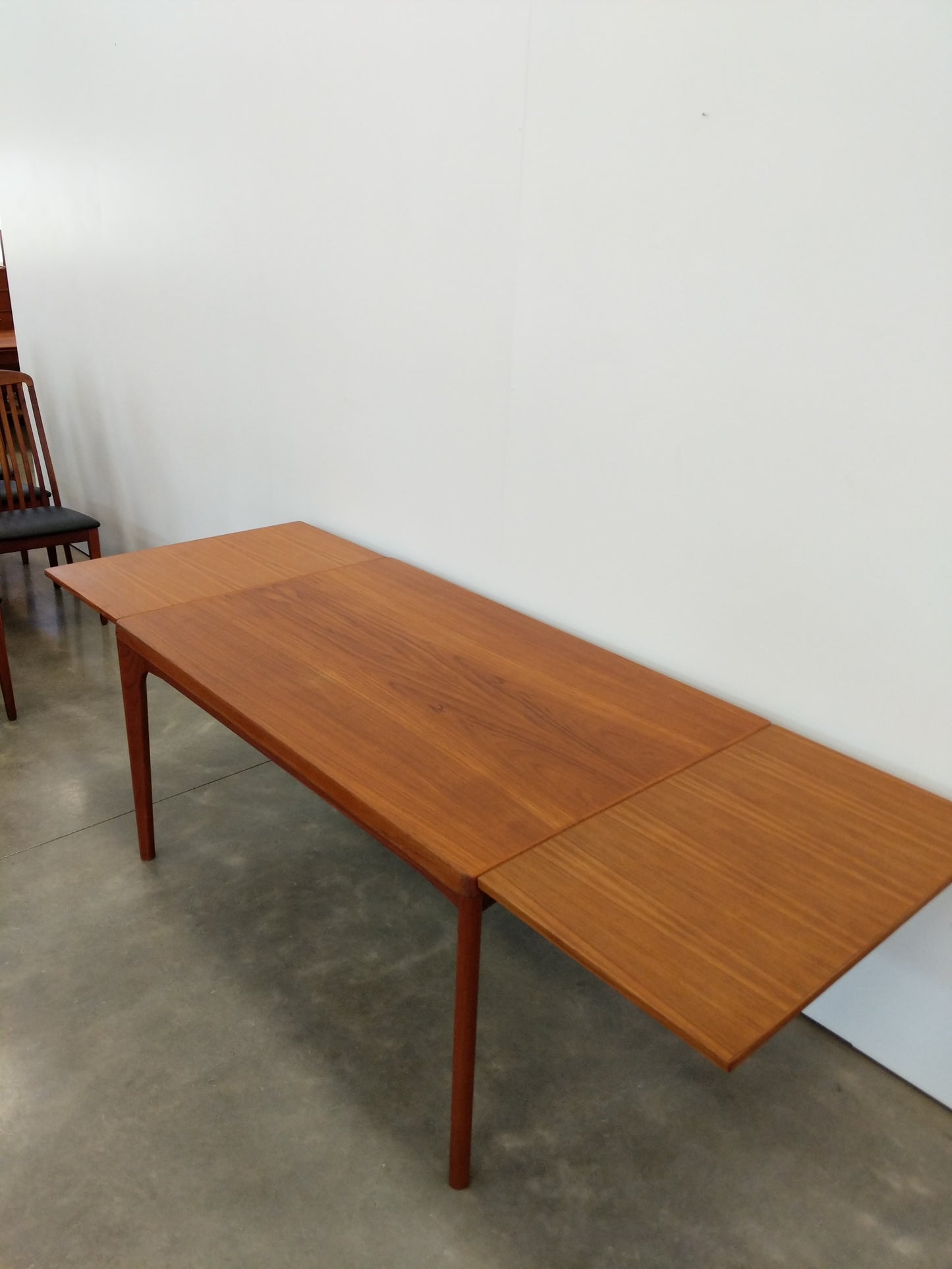 Vintage Danish Modern Teak Extendable Dining Table by Henning Kjaernulf